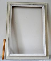 Front view of entire off-white wooden frame