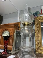 Full lamp showing base, font, burner and chimney