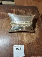 Top view of closed pillow box showing shape and finish