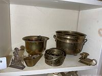 Shelf view of all brass and copper items together