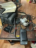 Overview with Sanyo bag, Kodak camera, charger, cables, manual