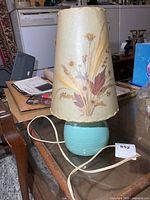 Full view of lamp showing base, shade and cord