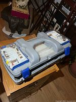 Closed grey Dremel case with accessory trays visible