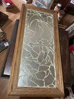 Full view of rectangular broken mirror mosaic art in wood frame