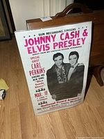 Full view of sleeved concert poster showing size and design