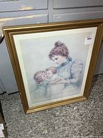 Full view of framed print showing image, mat and gold frame