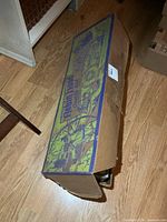 Closed original box showing graphics and wear