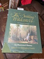 Front cover showing title, author, illustration, torn dust jacket