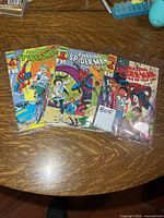 Front covers of all three Spider-Man comics in plastic sleeves