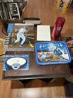 All items on tabletop – tray, Star Stick tube, photo, autograph card