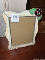 Front view of stained glass 8x10 frame showing border and floral accent