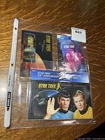 All four Star Trek stamp sets in plastic sleeve