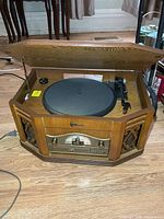 Full view of Emerson wood cabinet stereo with lid open showing turntable