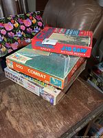 Stack of four vintage puzzle boxes