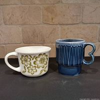 Front view of both mugs showing overall design and color