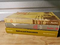 spine view of all three books stacked