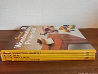 Spine view of four Sunset books stacked