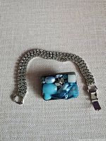 Buckle/brooch and bracelet laid flat for full view