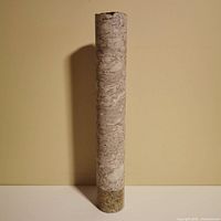 Full view of concrete core sample standing upright