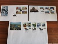 Overview of three first day covers on table