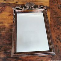 Full view of mirror showing frame design and glass