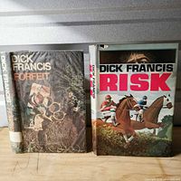 Front view of both books standing upright