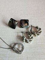 Necklace with rhinestone pendant, square earrings, pearl hoop earrings