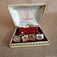 Open Guardsman case showing cufflinks, tie clip and tie tack