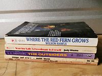 Stacked view of all five paperback titles