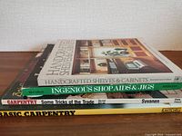Side view showing spines of the four woodworking books