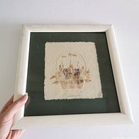 Front view of framed pressed flower art