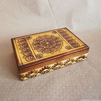 Top view showing carved and painted mandala design