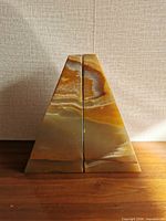 front view of both onyx bookends showing banded pattern and overall shape