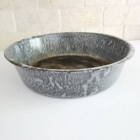 Top angled view of graniteware dish pan showing interior and rim wear