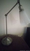 Lamp standing upright showing full profile