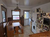 Full breakfast nook showing L-shaped bench, table, bench