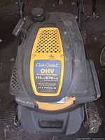 Top view of Cub Cadet mower showing brand badge, OHV 173cc label and self-propelled notation