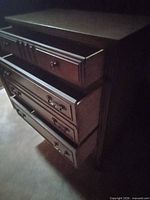 Front view with three drawers open