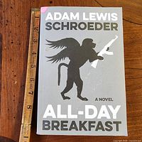 Front cover with title, author, novel designation and ruler for scale