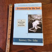 Front cover with title, author and subtitle visible, ruler beside for scale