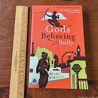 Front cover of the book beside ruler for scale