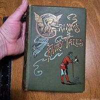 Front cover showing title, gilt and colour illustration