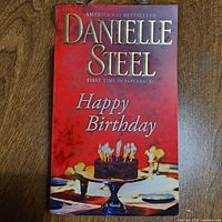 Front cover of "Happy Birthday" paperback showing title, author and artwork
