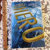 Front cover of Hero hardcover with ruler for scale