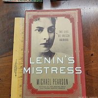Front cover of Lenin's Mistress hardcover book beside ruler for scale