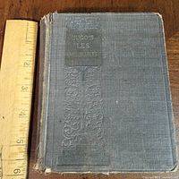 Front cover showing embossed cloth and wear