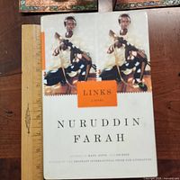 Front cover of Links hardcover with ruler for scale