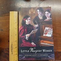 Front cover of Little Vampire Women with ruler for scale
