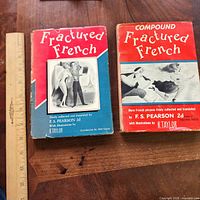 Front covers of both books with ruler for scale