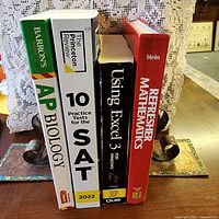 Spines of all four books standing together